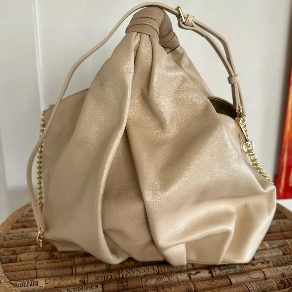 NWT gorgeous gold leather handbag. Detachable shoulder strap. Gold and beige